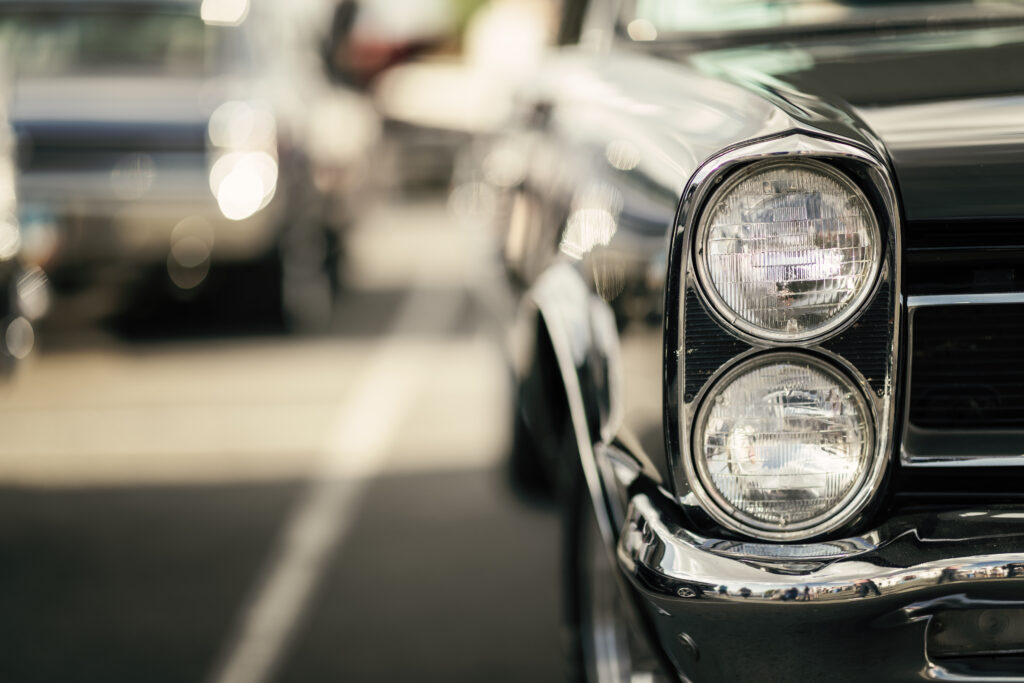 Photo of the right front of a classic black car